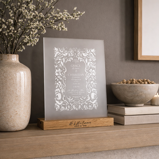 Decorative acrylic invitation etch on a wooden shelf with a vase and bowl in a home setting