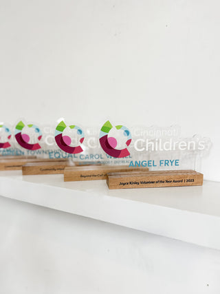 acrylic award for company with an oak wood base 