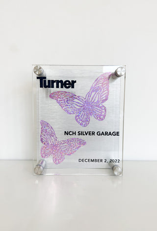 custom acrylic memento with company name and purple sparkly butterflies