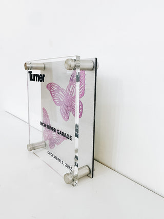 custom clear acrylic memento with company name and purple sparkly butterflies