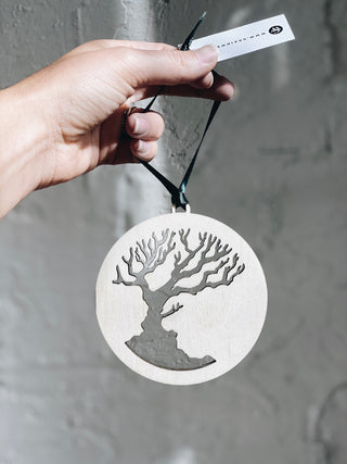 custom birchwood ornament with a cutout tree design 