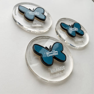 custom clear acrylic circular memento with blue butterfly detail