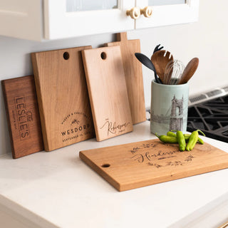custom cutting board with multiple wood types and engraved details