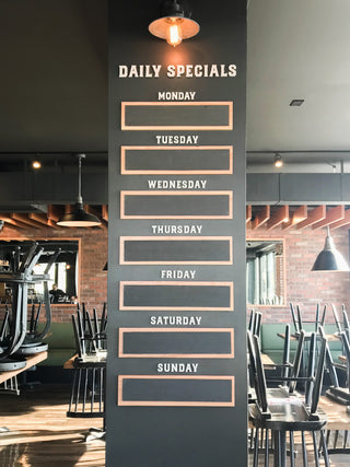custom daily specials sign on a podium in a restaurant