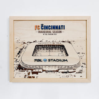 framed award with engraved image of a stadium and blue and orange raised lettering