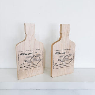 maple hardwood award in the shape of a bottle with engraved text and kentucky outline