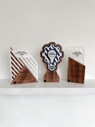 walnut hardwood awards in distinctive shapes with acrylic layering 
