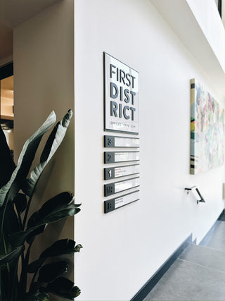 custom wayfinding sign with black and white acrylic for first district 