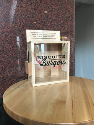 custom wood suggestion box with plexi glass front with company name and engraved text