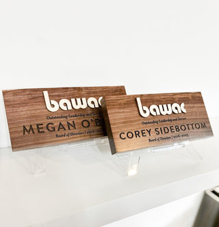 walnut wood award with raised wood company name and engraved words