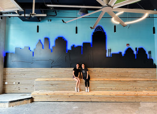 large scale installation black cincinnati city outline with blue glowing outline