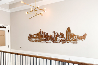 large scale installation of the cincinnati skyline in a illustrative style