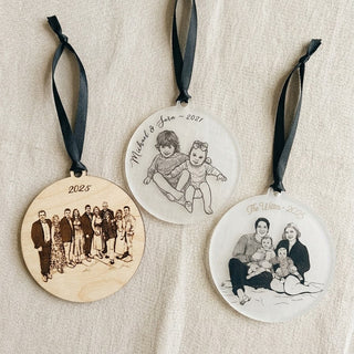 Three personalized Christmas ornaments with family photos and text on a beige fabric background.