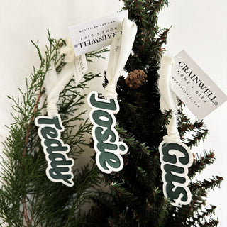personalized acrylic stocking tags with green paint fill