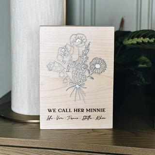personalized we call her minnie floral birth month plaque maple wood with white painted birch lettering